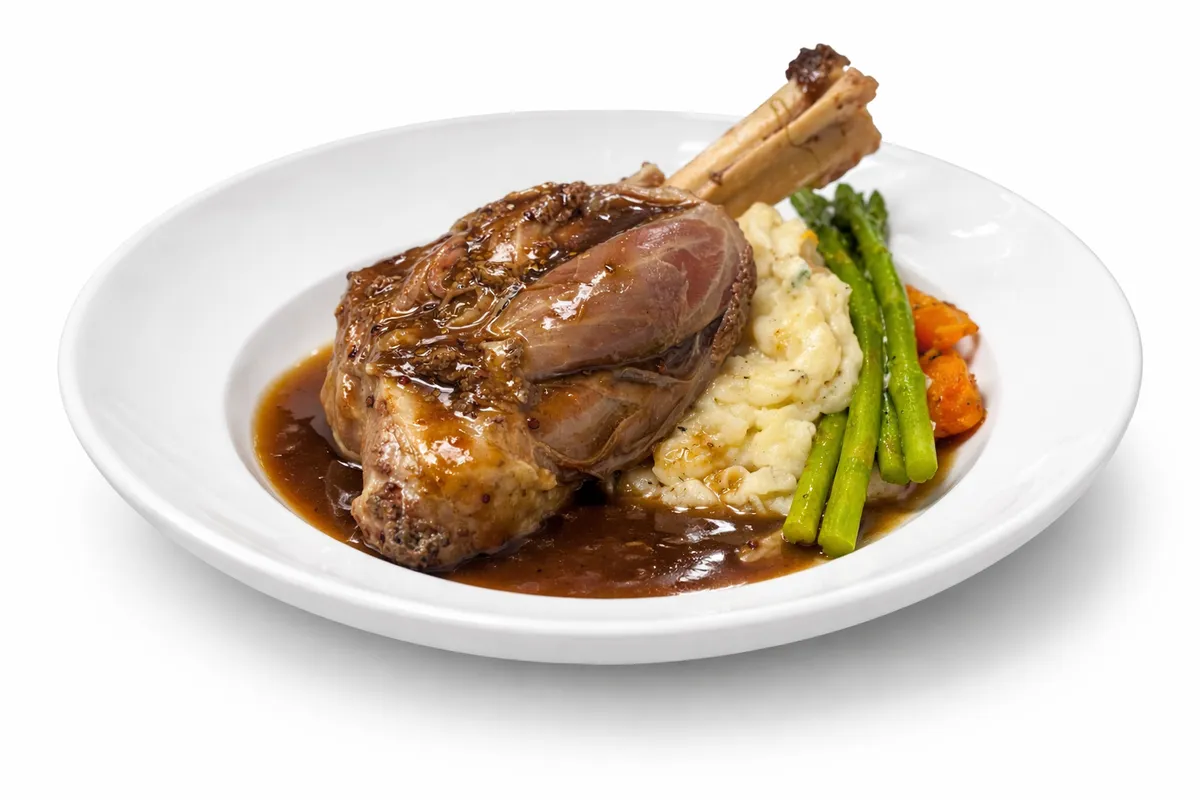 Braised lamb shank with mashed potatoes and vegetables